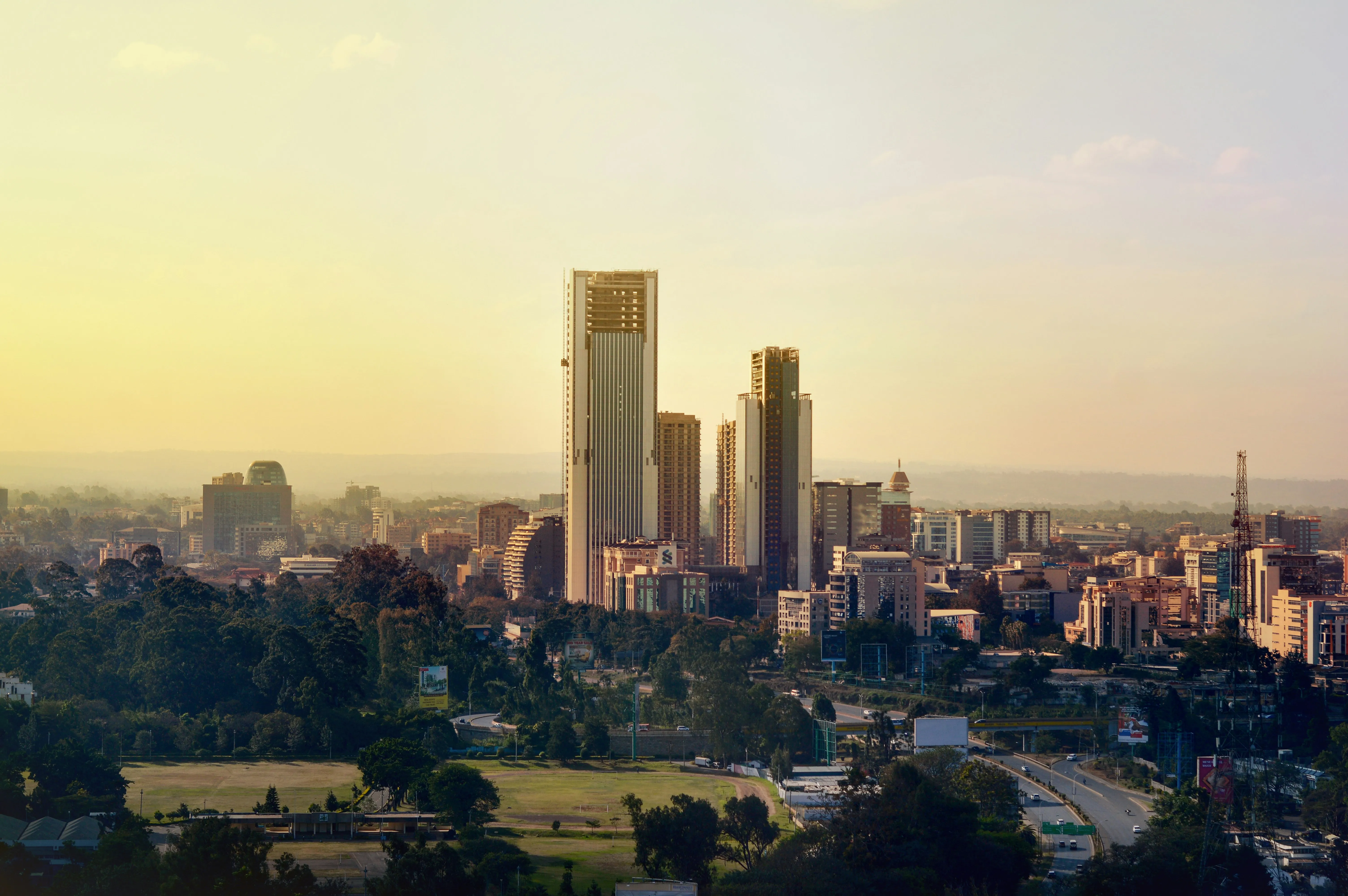 The Nairobi skyline under overcast sky.