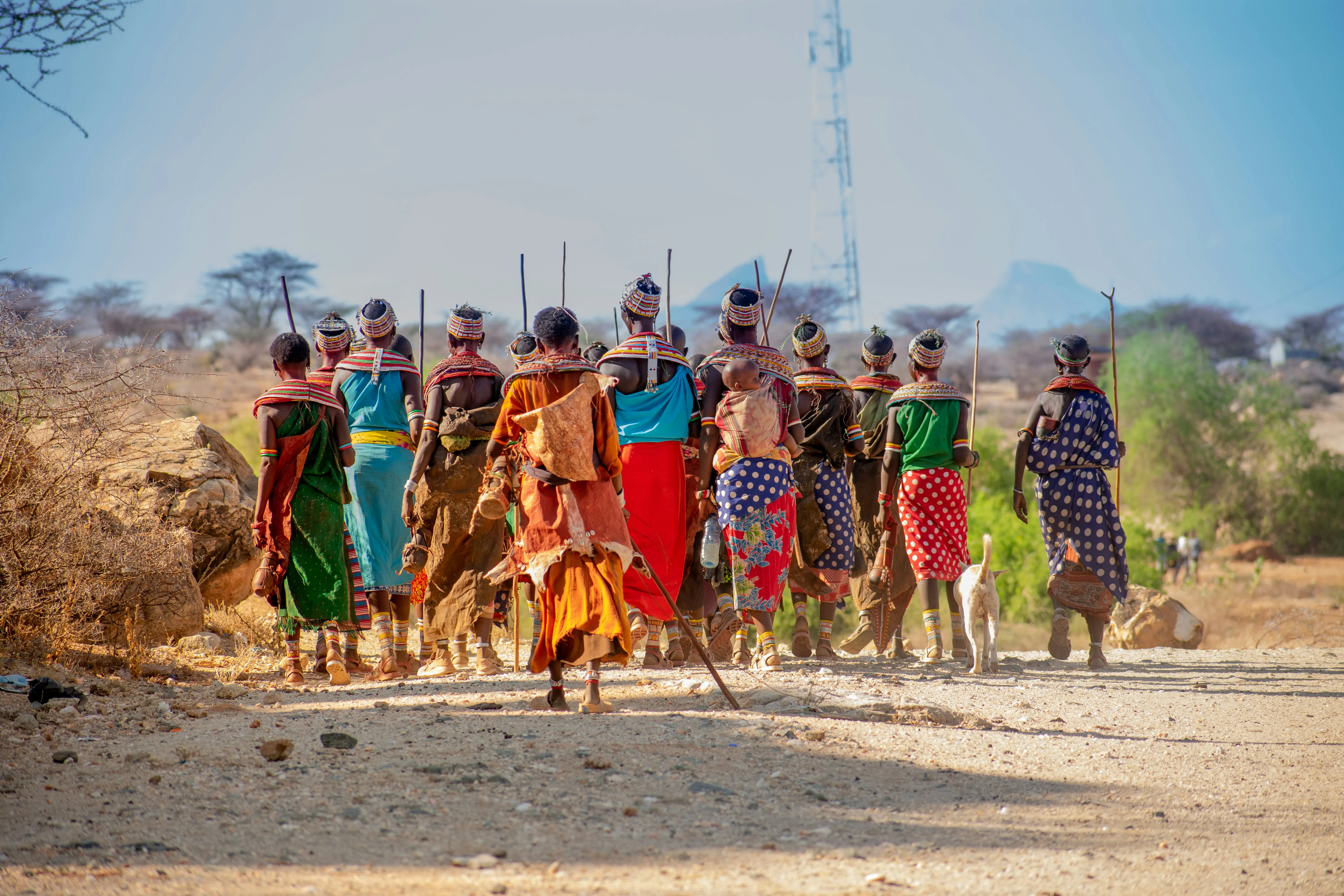 Samburu community members walking together in traditional dress.